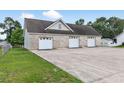 Spacious detached garage with multiple bays and ample parking on a concrete driveway at 131 Pine Lake Circle, Ocean Isle Beach, NC 28469