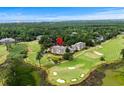 Scenic aerial view of low-rise condos on a golf course, surrounded by trees and overlooking a distant cityscape at 1401 Lighthouse Dr. # 4334, Little River, SC 29566