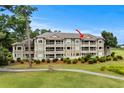 Charming condo building with screened in porches overlooking manicured lawn and a golf course at 1401 Lighthouse Dr. # 4334, Little River, SC 29566