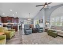 Open-concept living area with vaulted ceilings, hardwood floors, and flowing transition to the kitchen at 1413 Cottage Cove Circle, North Myrtle Beach, SC 29582
