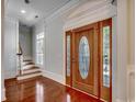 Inviting entryway featuring a decorative wood door and hardwood floors at 1613 James Island Ave., North Myrtle Beach, SC 29582