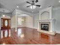 Elegant living room with fireplace, hardwood floors, and detailed trim at 1613 James Island Ave., North Myrtle Beach, SC 29582
