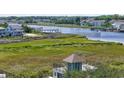 Breathtaking marsh view from the rooftop deck with a waterfront scene, docks, and a serene river at 1663 Harbor Dr., North Myrtle Beach, SC 29582