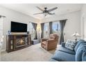 Cozy living room with fireplace, TV, comfortable seating, and lots of natural light at 2000 Cross Gate Blvd. # 202, Surfside Beach, SC 29575