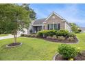 Charming single Gathering home with brick and vinyl siding, manicured lawn and garden at 2010 Chattooga Ct., Myrtle Beach, SC 29588