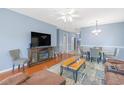 Inviting living room featuring hardwood floors, a large television, and comfortable seating at 2060 Cross Gate Blvd. # 102, Surfside Beach, SC 29575