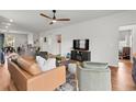 Cozy living room with open layout, featuring modern furniture and hardwood floors at 228 Averyville Dr., Conway, SC 29526