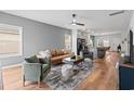 Bright living room featuring modern decor, hardwood floors, and a ceiling fan at 228 Averyville Dr., Conway, SC 29526