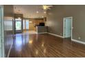 View of kitchen and dining area from the living room with open floor plan, recessed lights and laminate floors at 244 Colby Ct., Myrtle Beach, SC 29588