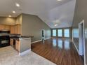 Spacious living room featuring laminate floors, high ceilings, plenty of natural light, and open floor plan at 244 Colby Ct., Myrtle Beach, SC 29588