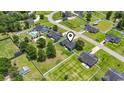 An aerial view shows the property's placement within a serene neighborhood with manicured lawns and mature trees at 250 Penn Circle, Galivants Ferry, SC 29544