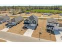 Aerial view of a residential neighborhood showcasing modern two-story homes and manicured lawns at 28 Cape Point Dr., Conway, SC 29527