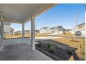 Inviting porch view of a well-manicured streetscape with modern homes and landscaping at 28 Cape Point Dr., Conway, SC 29527