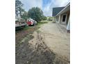 Exterior showcasing sandy lot, featuring a bobcat and a view of the construction and surrounding neighborhood at 287 All Saints Loop, Pawleys Island, SC 29585