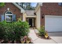 Inviting front entrance with lovely landscaping and a well-maintained walkway at 364 Vesta Dr., Myrtle Beach, SC 29579