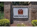 The Villages of Arrowhead community sign displayed on a brick wall with green foliage at 364 Vesta Dr., Myrtle Beach, SC 29579