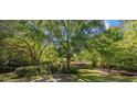 Charming home nestled among mature trees, offering a serene and private setting with a welcoming front porch at 3772 Brown Bark Ln., Murrells Inlet, SC 29576