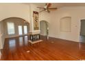 Spacious living room with hardwood floors, a fireplace, a ceiling fan, and lots of natural light at 413 Sea Vista Ln., North Myrtle Beach, SC 29582