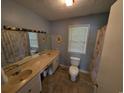 Bathroom featuring double sinks, a large mirror, and a shower/tub combination at 5370 Miracle Ln., Conway, SC 29526