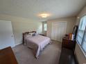 Cozy bedroom with neutral walls, carpet flooring, a window and ample closet space at 5370 Miracle Ln., Conway, SC 29526