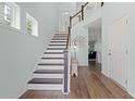 Inviting foyer with a staircase, hardwood floors and plenty of natural light at 540 Chanted Dr., Murrells Inlet, SC 29576