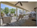 Spacious covered porch with outdoor seating perfect for entertaining guests or relaxing outdoors at 6001- P16A S Kings Highway, Myrtle Beach, SC 29575
