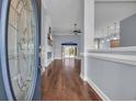 Inviting foyer featuring a decorative glass front door, hardwood floors, and a view into the spacious living areas at 760 Carolina Farms Blvd., Myrtle Beach, SC 29579