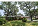 Classic single-story brick home with a well-maintained lawn and mature shade trees at 951 Herriott Farms Dr., Georgetown, SC 29440