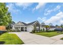 Well-manicured lawn and landscaping enhance this home with stone accents and an attached garage at 1024 Pochard Dr., Conway, SC 29526