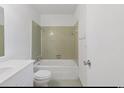 A compact bathroom features a shower-tub combination, tiled walls, and standard fixtures at 1025 Carolina Rd. # H4, Conway, SC 29526
