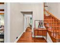 Inviting hallway features hardwood floors and stairs, leading to the upper level and other rooms at 1072 Chelsey Circle, Conway, SC 29526