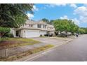 A row of townhomes, each featuring a white garage door and well-maintained lawns, offering comfortable community living at 1120 Fairway Ln. # 1120, Conway, SC 29526