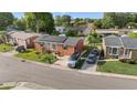 Aerial view of a brick home featuring solar panels and ample parking at 1145 Forest Dr., North Myrtle Beach, SC 29582