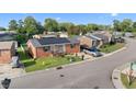 Street view of charming brick home with solar panels and well-maintained lawn at 1145 Forest Dr., North Myrtle Beach, SC 29582