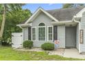 Close up of the front of the home showing the windows and front entrance at 1331 Bermuda Ct., Surfside Beach, SC 29575