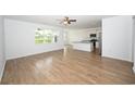 Spacious living room with hardwood floors, natural light, and an open-concept design at 2002 Sweetflag Dr., Longs, SC 29568