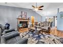 Spacious living room with fireplace, ceiling fan, and ample seating at 201 Surrey Ln., Myrtle Beach, SC 29579