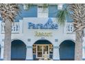 Close-up of the Paradise Resort entrance, showcasing its architectural details and landscaping at 2201 S Ocean Blvd. # 103, Myrtle Beach, SC 29577