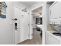 Functional laundry area with gray walls and modern appliances including a full size washer and dryer at 2201 S Ocean Blvd. # 103, Myrtle Beach, SC 29577