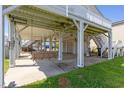 Ground level showing a swing, storage, and covered parking at 3307 Nixon St., North Myrtle Beach, SC 29582