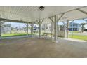 View of the outdoor entertaining space on the ground level with covered picnic table and parking at 3307 Nixon St., North Myrtle Beach, SC 29582