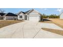 Charming home featuring a two-car garage and long drive way at 369 Log Cabin Rd., Loris, SC 29569