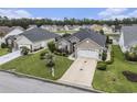Desirable one-story home featuring a lawn, a palm tree, and an attached two-car garage at 388 Sea Turtle Dr., Myrtle Beach, SC 29588