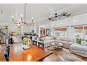 Spacious open-concept living area with wood floors, white walls, and a large sectional sofa at 3930 West Marion St., Mullins, SC 29574