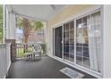 Relaxing outdoor patio with a sliding glass door, exterior views, and patio furniture at 4261 Hibiscus Dr. # 4-104, Little River, SC 29566