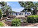 Landscaped entrance to Cypress Bay community with prominent signage at 4290 Pinehurst Circle # B3, Little River, SC 29566