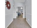 Bright hallway featuring tile floors and easy access to the kitchen and living areas at 4520 Lighthouse Dr. # 29B, Little River, SC 29566