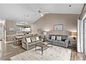 Comfortable living room with vaulted ceilings, a ceiling fan, and two sofas with a view of the dining area at 4655 Wild Iris Dr. # 41-303, Myrtle Beach, SC 29577