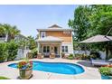 Inviting backyard pool with lounge area, patio seating, and well-maintained landscaping at 5 Ruth St., Murrells Inlet, SC 29576