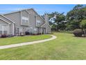 Condo with a lawn, bordered by a fence, features a patio area with outdoor furniture at 503 N 20Th Ave. N # 41D, North Myrtle Beach, SC 29582